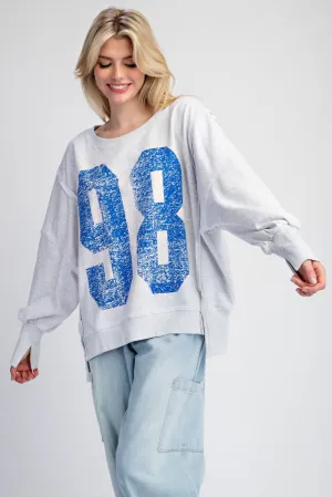 Faded varsity print long sleeve pullover top